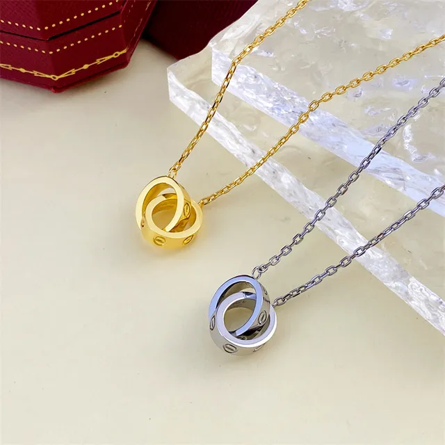 Gold and Silver Interlocking Ring Pendant Necklaces 3