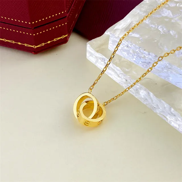 Gold and Silver Interlocking Ring Pendant Necklaces 4