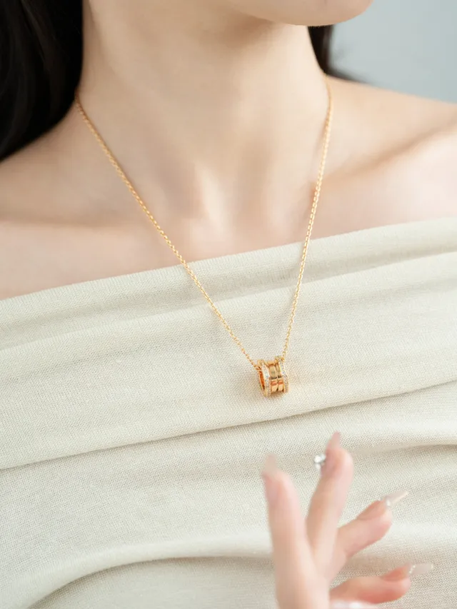 Gold and Silver Tone Pavé Multi-Ring Cylindrical Pendant Necklaces 3