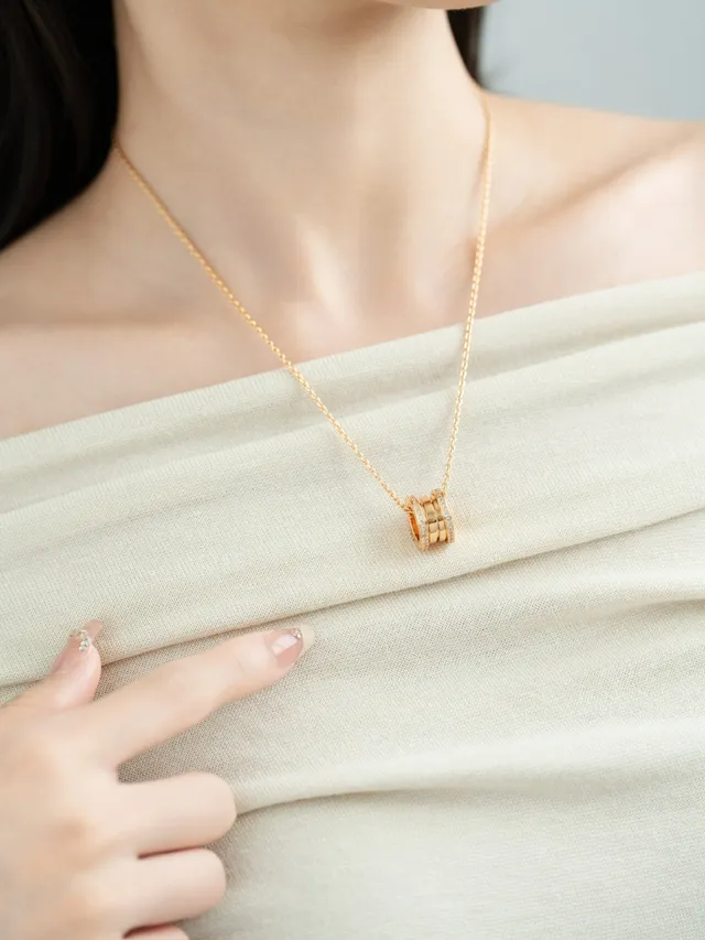 Gold and Silver Tone Pavé Multi-Ring Cylindrical Pendant Necklaces 4