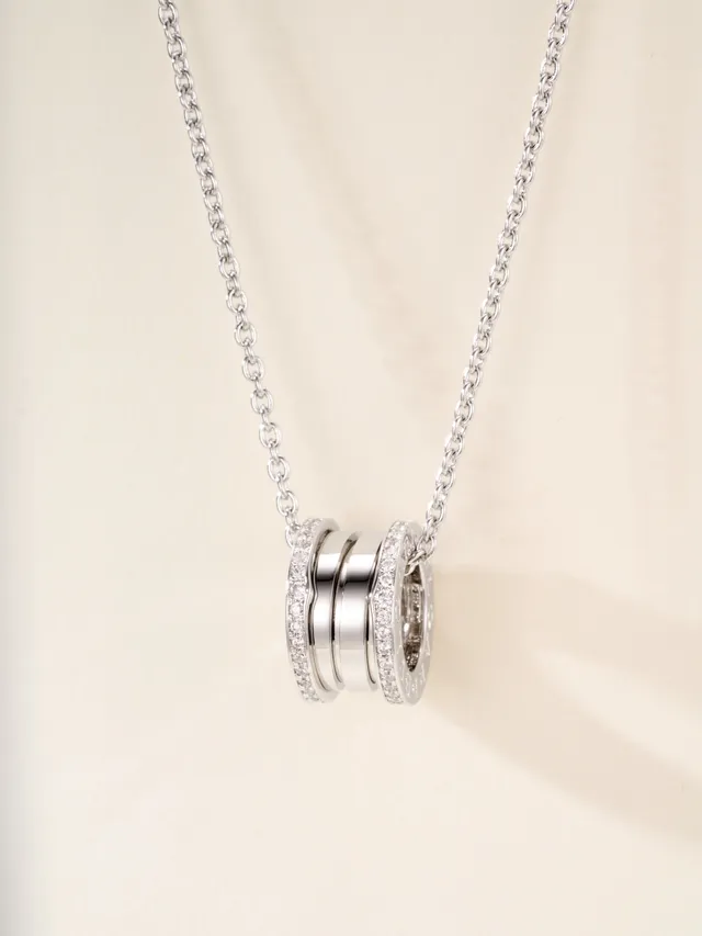 Gold and Silver Tone Pavé Multi-Ring Cylindrical Pendant Necklaces 16