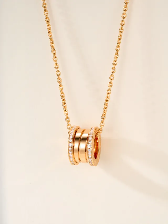 Gold and Silver Tone Pavé Multi-Ring Cylindrical Pendant Necklaces 17