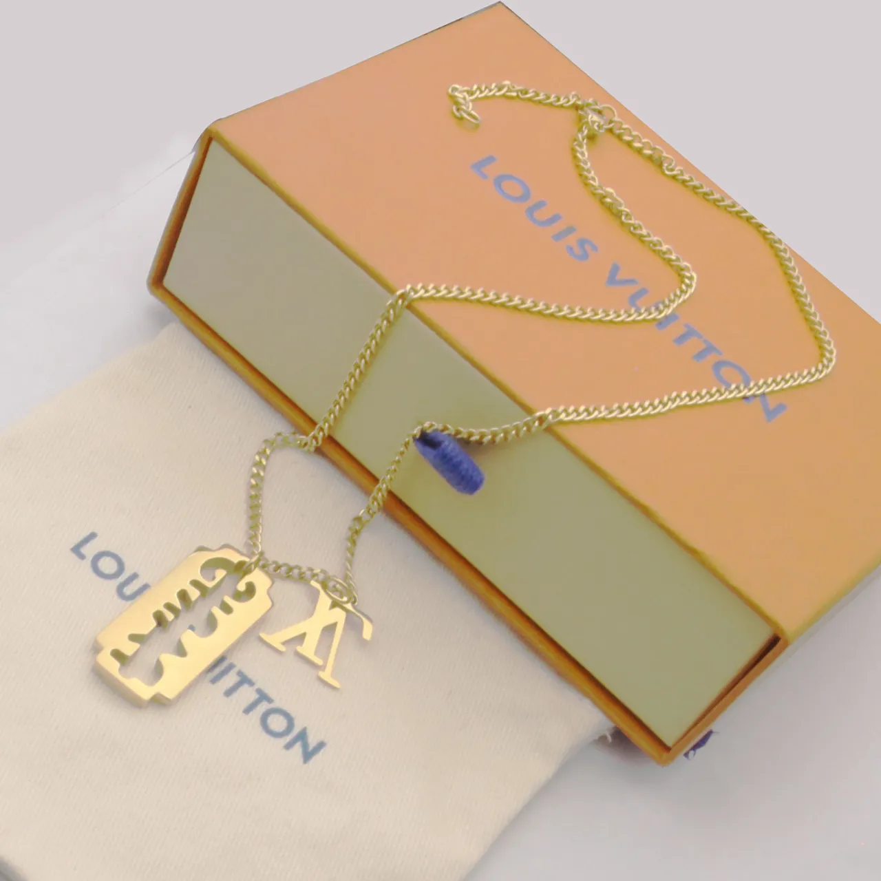 Gold Silver Razor-Blade-Shaped Pendant Cutout Monogram Motif Necklace 6