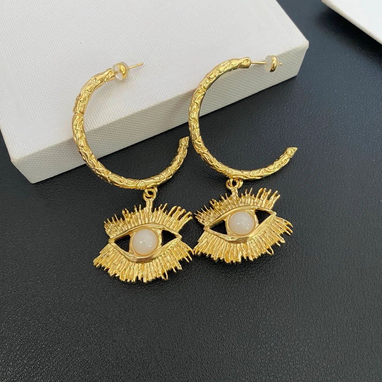 Gold White Textured Hoop Eye Motif Pendant Earrings 4