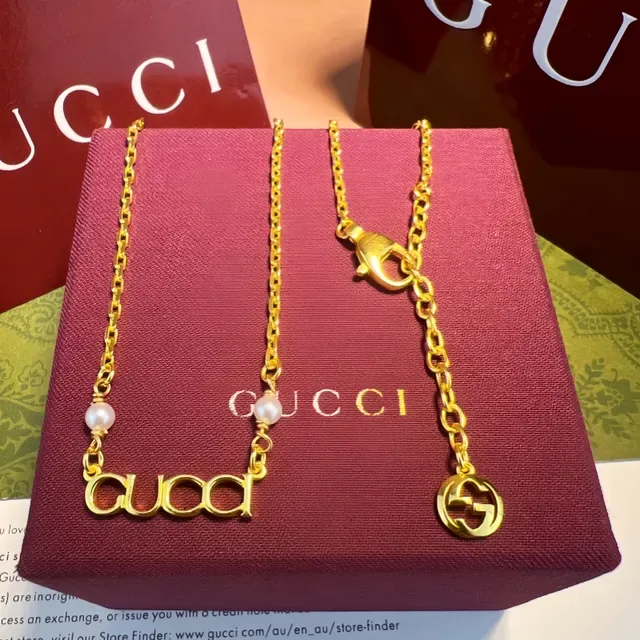Gucci Alphabet Collection Gold White Chain Interlocking G Charm Bracelet 7
