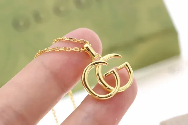 Gucci Double G Gold-Tone Interlocking Pendant Necklace 9