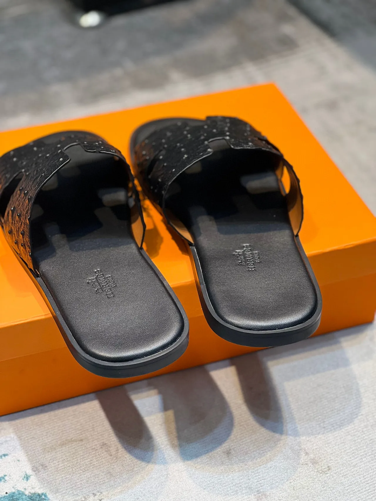 Hermès Black H-Shaped Strap Ostrich-Textured Leather Slippers 3