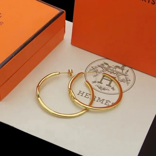 أقراط حلقية Hermès ذهبية ومينا أحمر 4