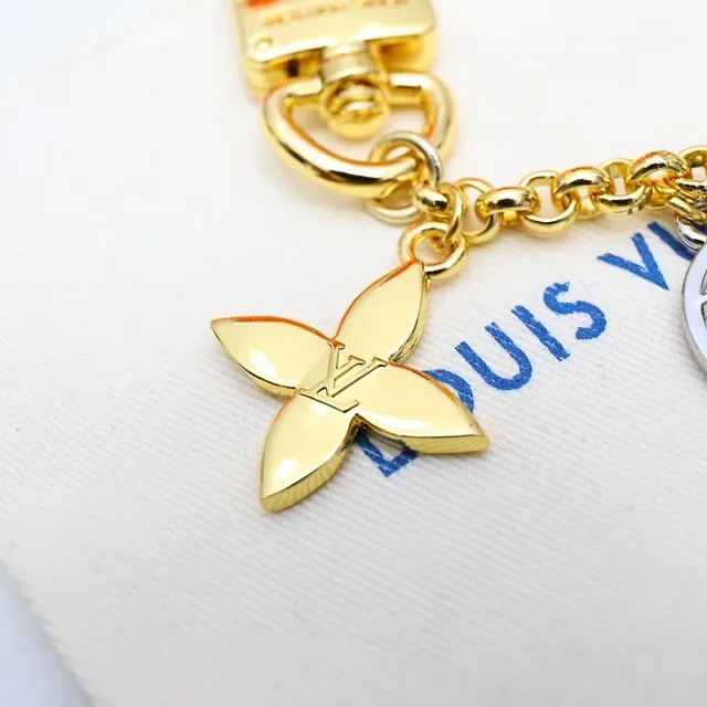 Louis Vuitton Gold Black Metal Multi-Charm Bracelet 9