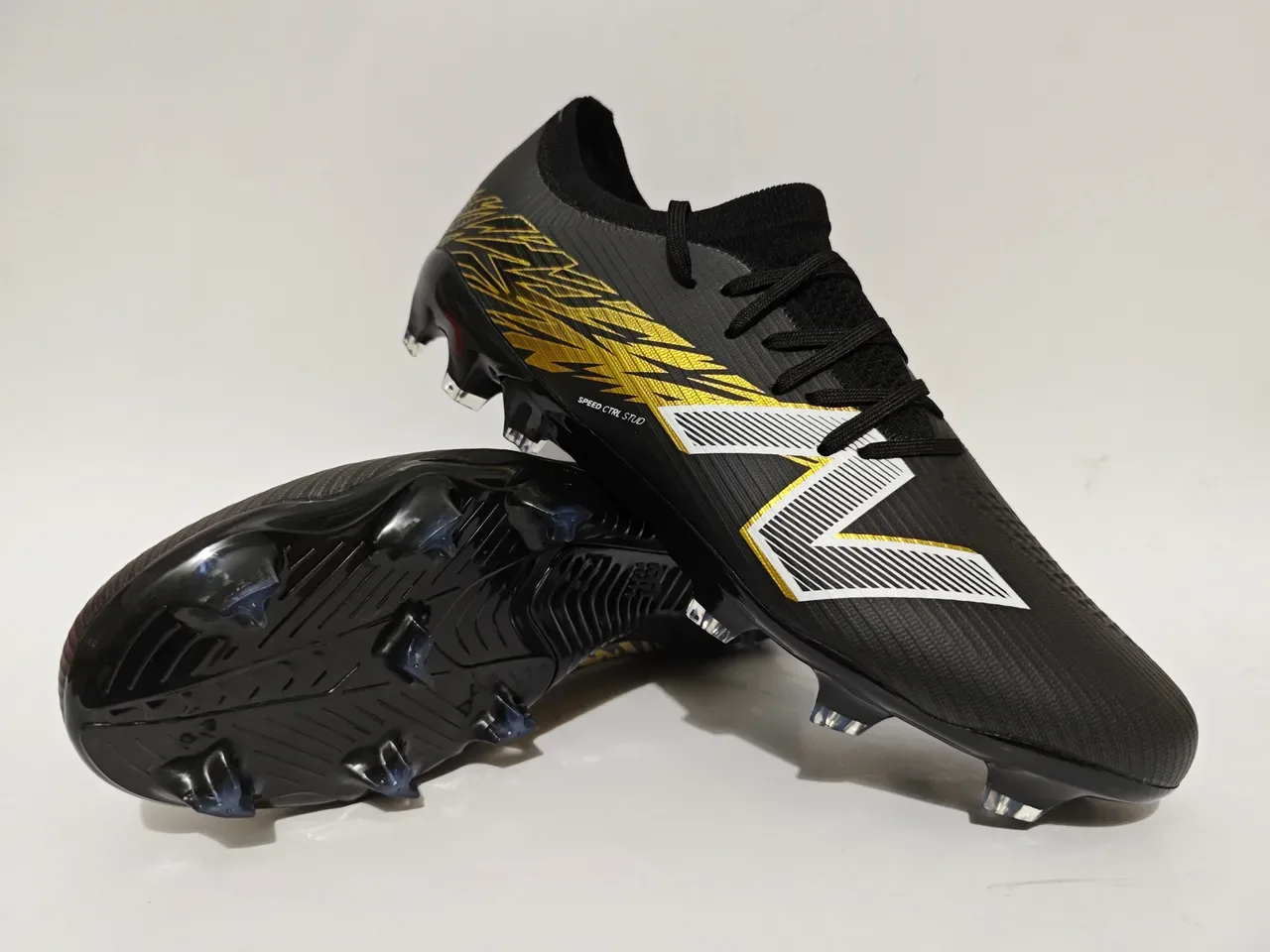 New Balance Chaussures de football blanc et or low-cut upper maille graphique lightning terrain ferme 3