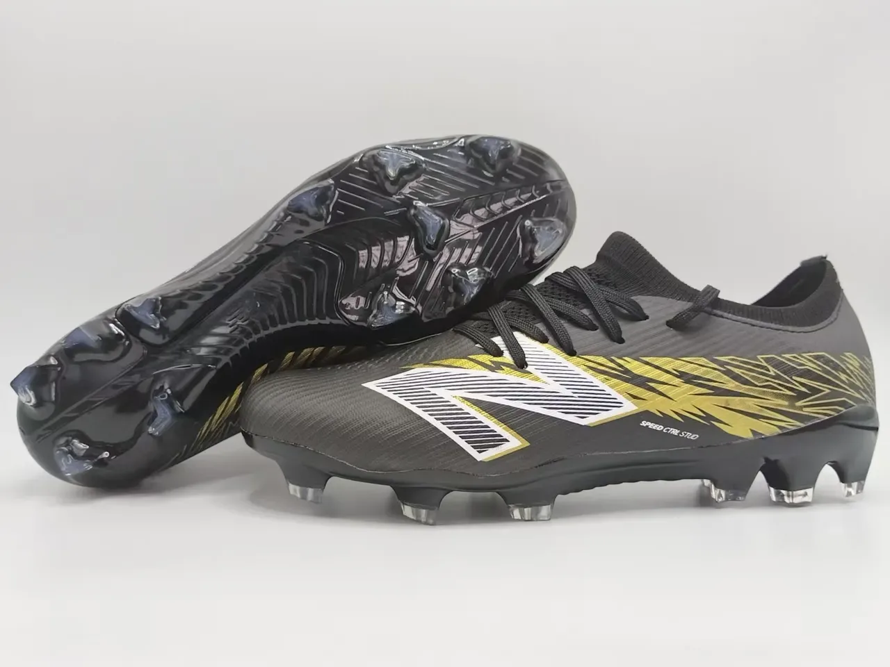 New Balance Chaussures de football blanc et or low-cut upper maille graphique lightning terrain ferme 4