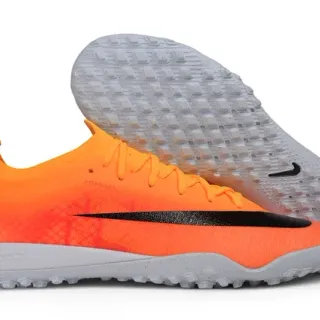 Nike Zapatillas de fútbol para césped con upper de punto color naranja y negro, cuello bajo