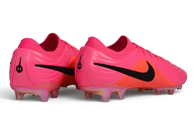 Nike Zapatos de fútbol rosa naranja con empeine sintético texturizado en ola, cuello de calcetín, para terreno firme 6