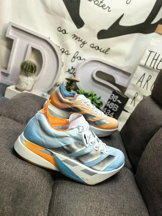 Adidas Zapatillas de running azul naranja silueta de carreras simplificada malla superior ingenieril 9