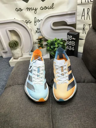 Adidas Zapatillas de running azul naranja silueta de carreras simplificada malla superior ingenieril 10