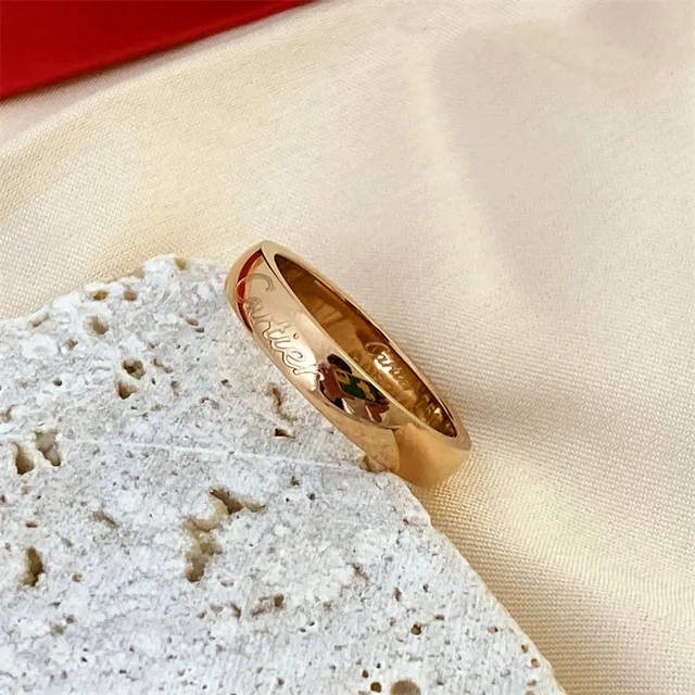 Cartier Gold Silver Engraved Cursive Logo Single-Stone Accent Ring 6