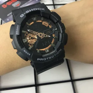 Casio G-Shock GA-100 أسود ونحاس ساعة رياضية