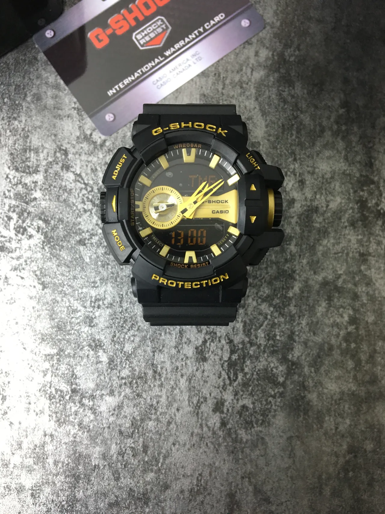 Casio G-Shock GA-100 Relógio esportivo preto e dourado 2