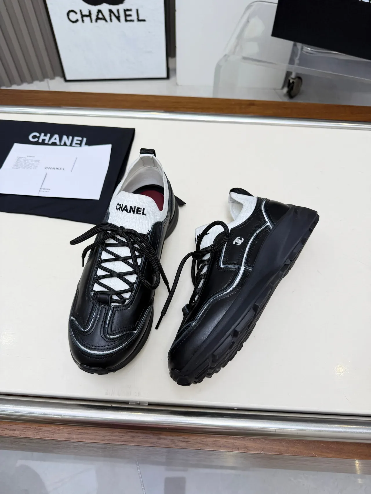 Chanel Runner-Style Sneaker Black and White Leather Lifestyle Sneakers 4