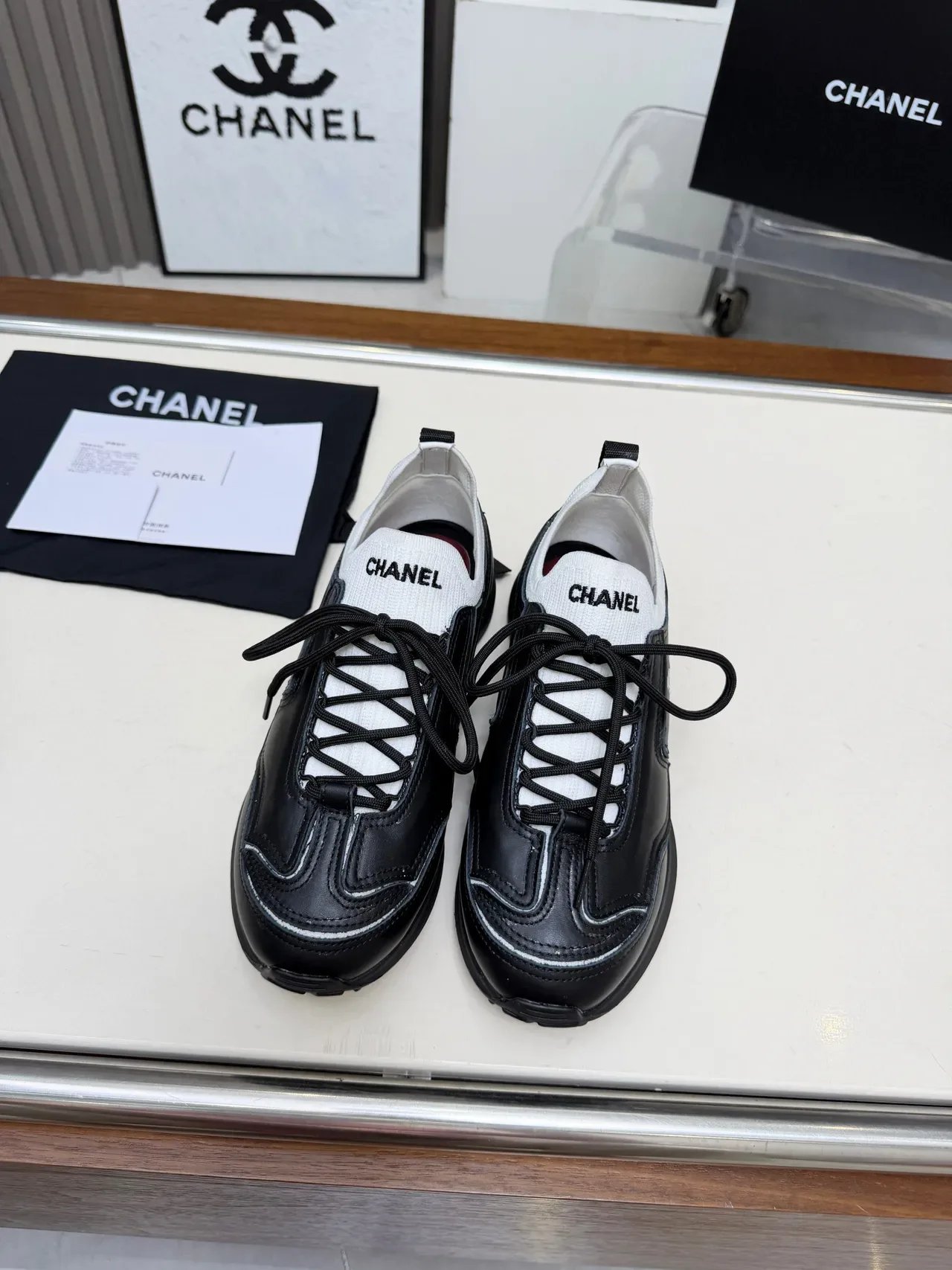 Chanel Runner-Style Sneaker Black and White Leather Lifestyle Sneakers 5