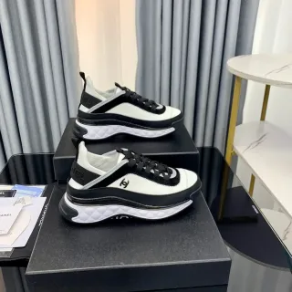 Chanel White Black Quilted Midsole Zippered Side Panel Lifestyle Sneakers