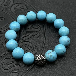 Pulsera de metal ornamentado simple con cuentas de piedra turquesa redonda azul plateada