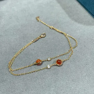 Pulsera con esferas cabochon de naranja y dorado en doble cadena