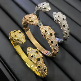 Pulsera pavé-set con motivo de cabeza de animal en oro y plata