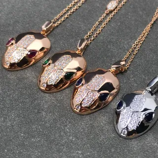 Collier or et argent motif tête de serpent pavé-set pierres blanches