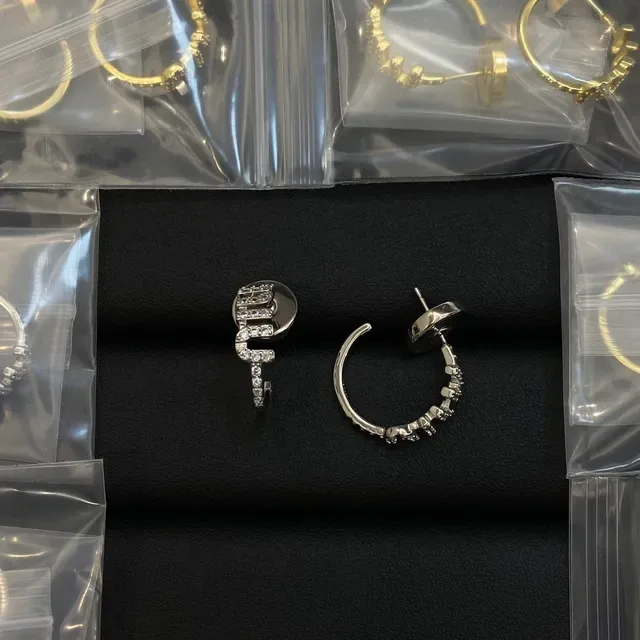 Gold-Tone Pavé Crystal Asymmetrical Hoop Earrings 2