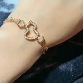 Pulseira de motivo de coração de cristal Pavé em tom dourado
