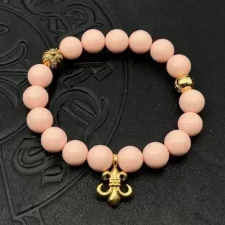 Pulsera elástica con cuentas rosa mate y Fleur-de-Lis en oro