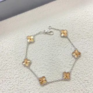 Cadena de plata y oro con flores de cuatro pétalos pulsera