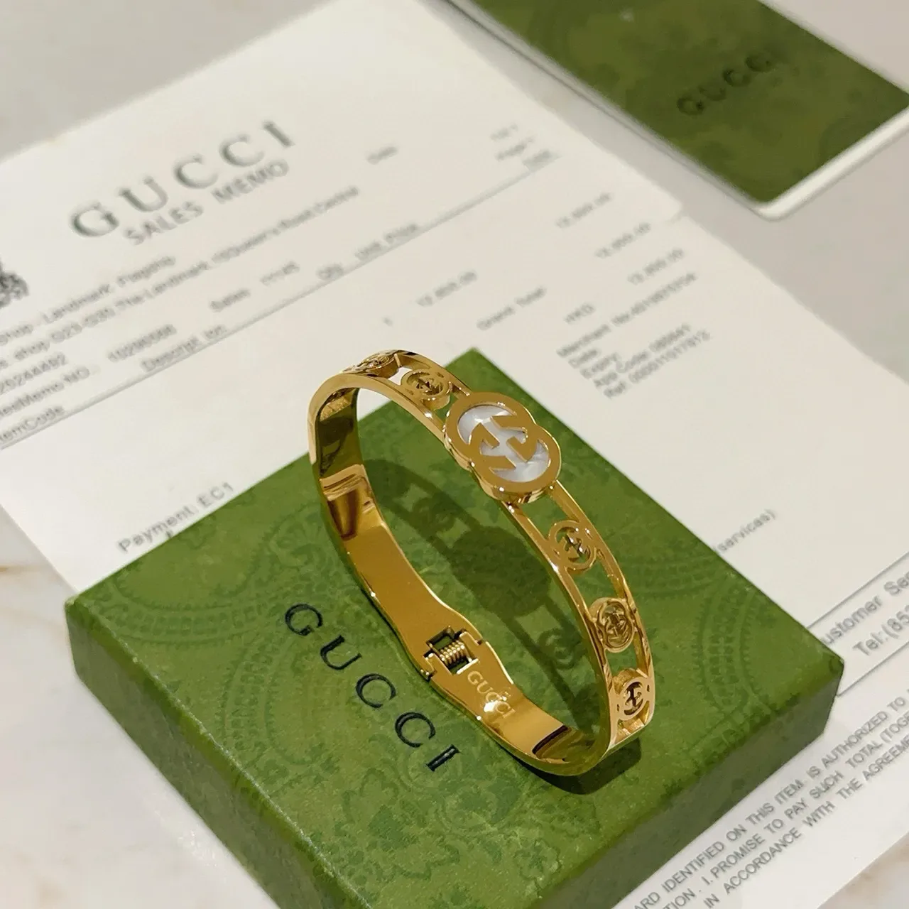 سوار Gucci GG Marmont لؤلؤ أم ذهبي اللون متشابك G 7