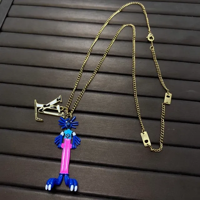 Louis Vuitton LV Monogram and Figurine Dual-Pendant Necklace 2