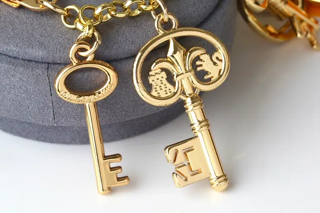 Louis Vuitton Multi-Charms Keychain Gold Metal Pendant Bracelet 6