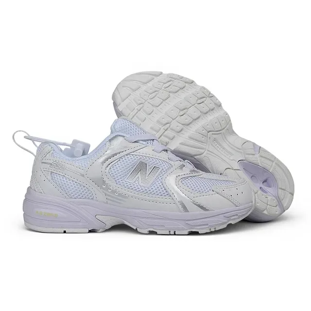 New Balance Chaussures lifestyle noires et blanches avec midsole chunky, empeigne hybride mesh-synthetique 12