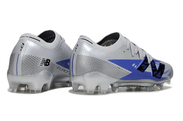 New Balance Azul Prateado Tênis de futebol de corte baixo com upper de ajuste a meia sola transparente moldada para campo firme 5
