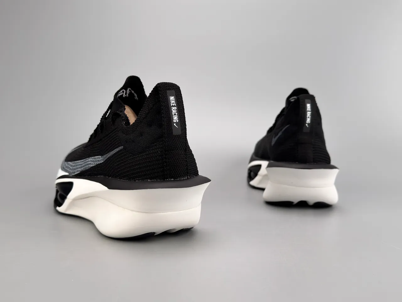 Nike Black White Knit Upper Asymmetrical Midsole Running Shoes 4