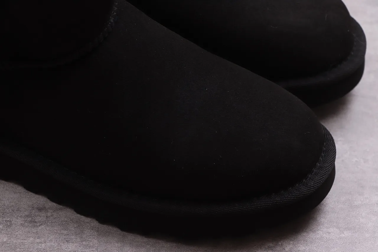 UGG Classic Short Black Shearling-Lined Snow Boots 16
