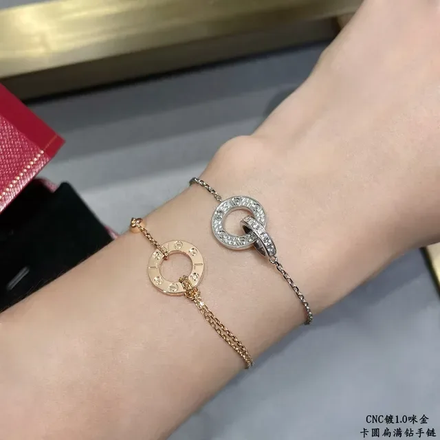 Cartier Bracelet or et argent motif double cercle entrelacé pavé pierres transparentes 9