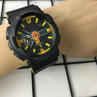 Casio G-Shock GA-100 أسود أصفر برتقالي ساعة رياضية