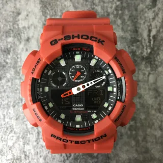 Casio G-Shock GA-100 ساعة رياضية برتقالية من الراتنج