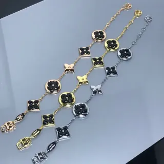 سوار أسود وذهبي مع تشارمز زهور إينمل وإنهاء معدني مختلط