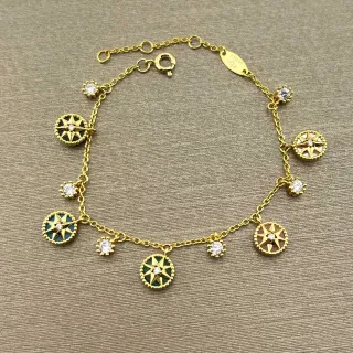 Pulsera de cadena dorada multicolor con colgantes de compás y estrella