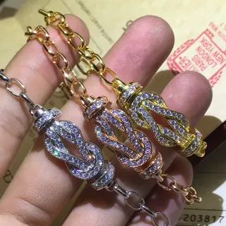 Pulsera de plata y oro pavé con cristales en forma de nudo