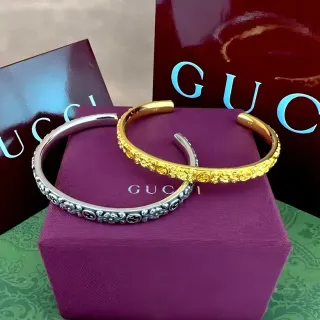 Gucci Ornate Monogrammed Gold and Silver Bangle Bracelets