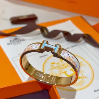 Hermès Clic H Motivo de caballo esmaltado Gold-Tone Pulsera