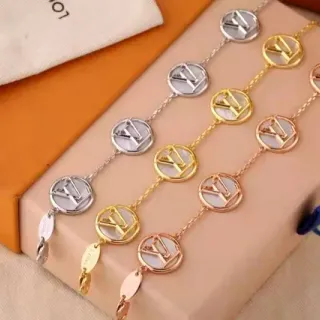 Louis Vuitton Pulsera de cadena de eslabones de oro y plata con medallón circular