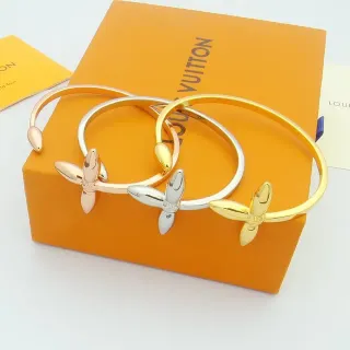 Louis Vuitton pulsera abierta de oro y plata con motivo floral de cuatro pétalos
